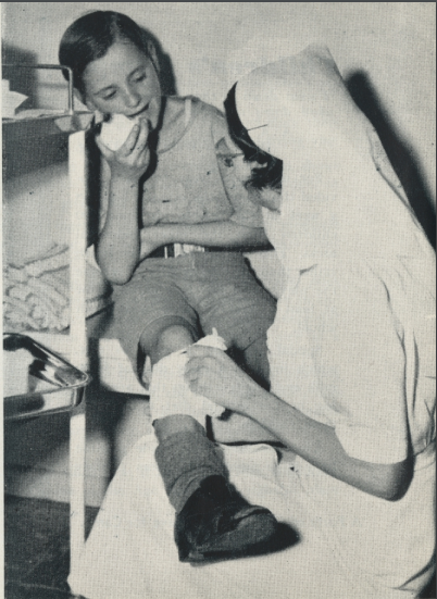 a photo of a nurse attending to a child