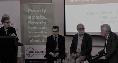 Shelley Mallett speaks at lectern during Anti-Poverty Talk