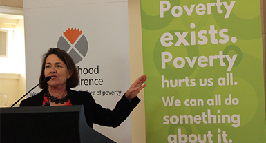 Toni Wren speaking at lecturn