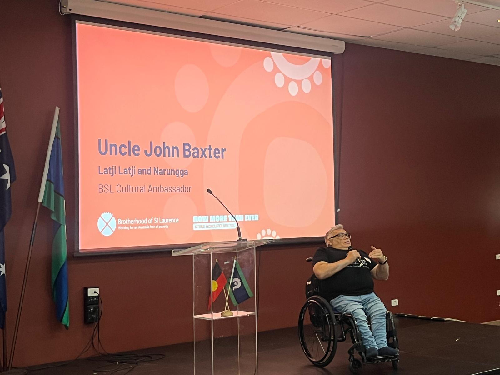 Uncle John Baxter speaks at a BSL event.
