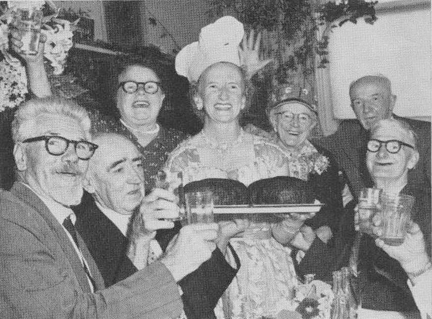 A black and white photo of Jessica Millott serving her famous puddings at the Coolibah Club.