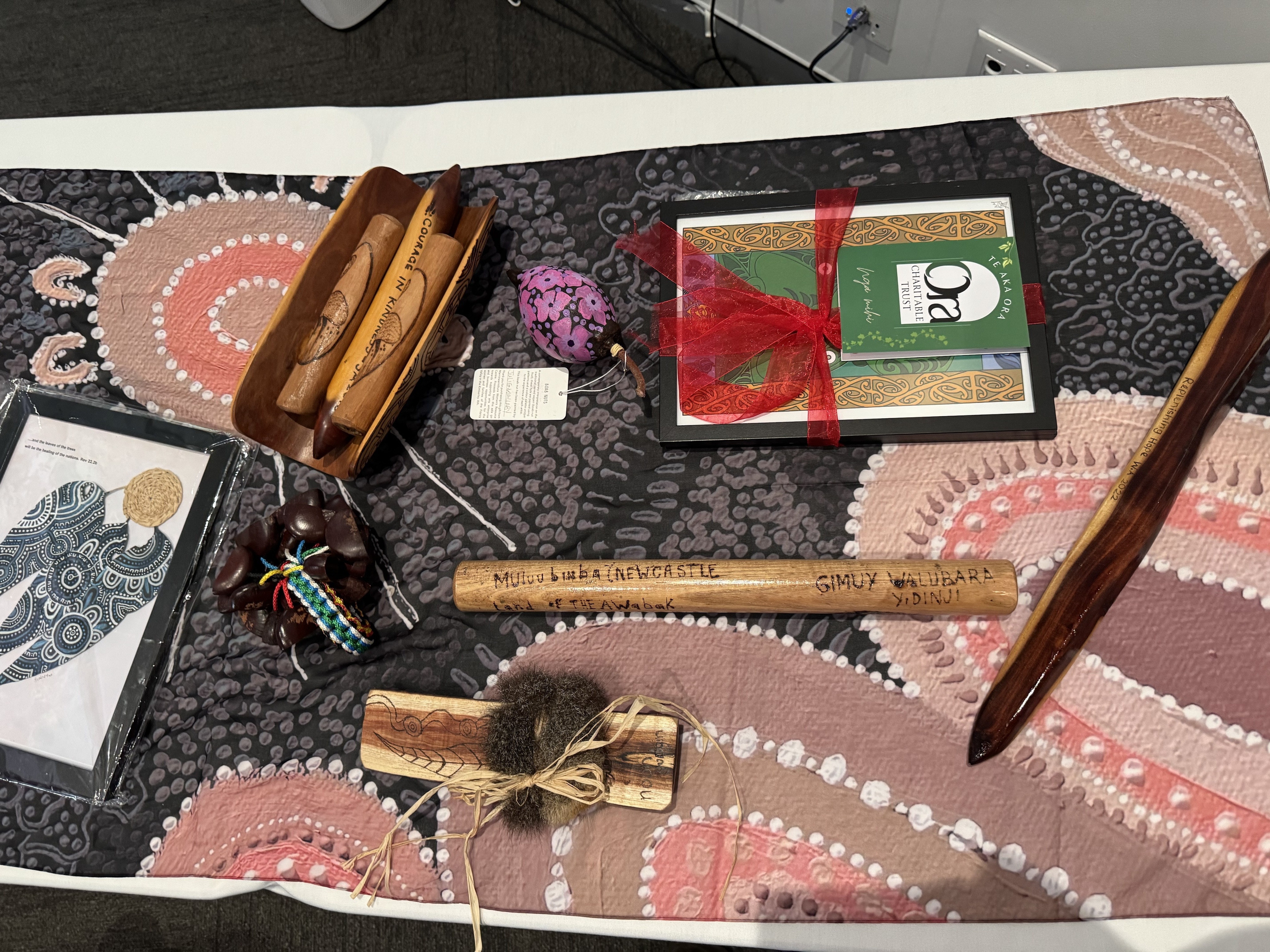 Wurundjeri message stick with cultural items at the Anglicare Conference 2026