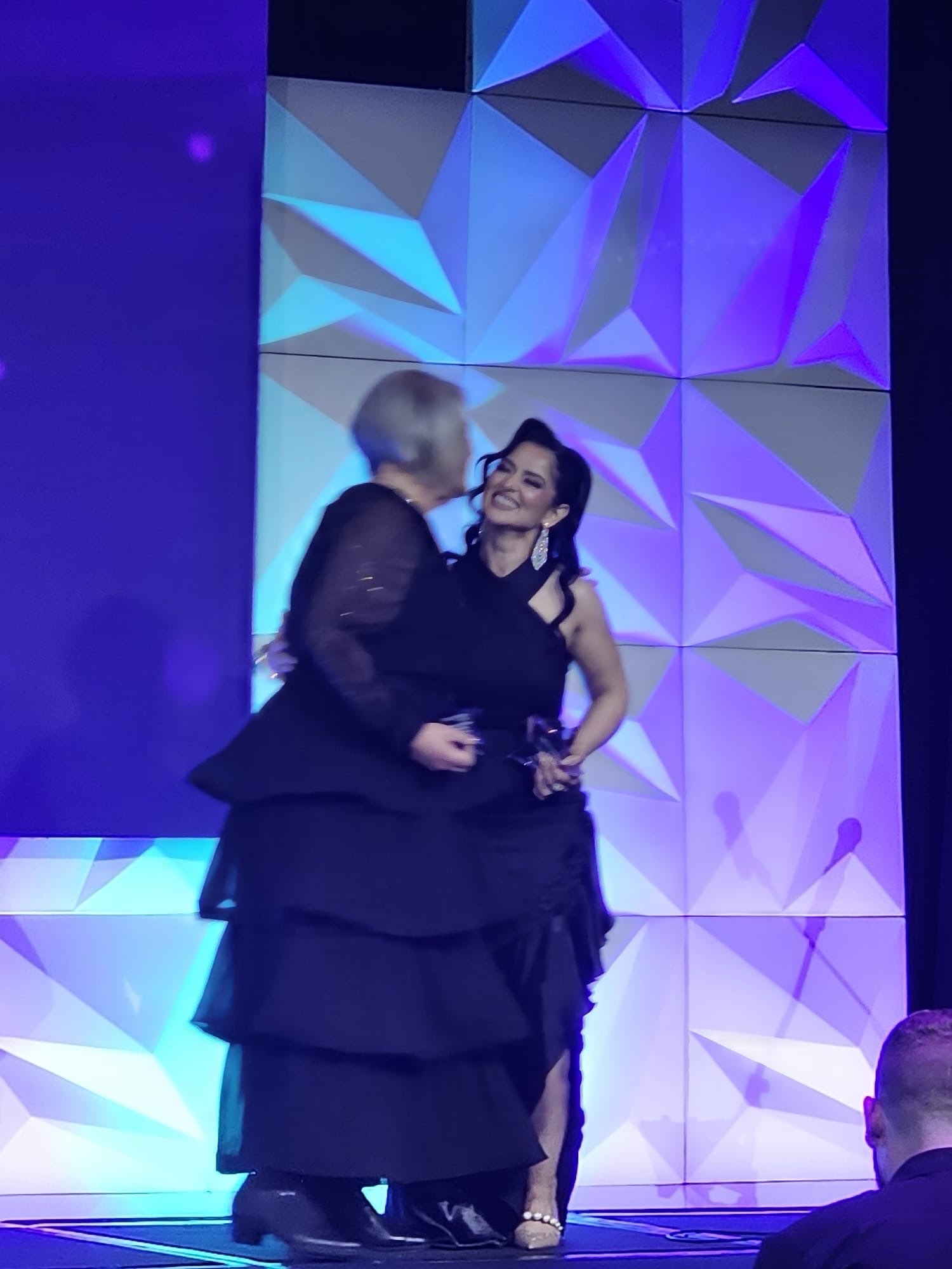 Ricah accepts her award.
