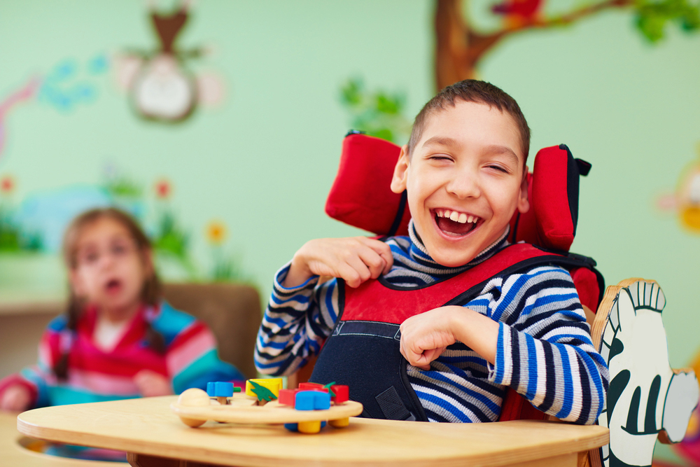 Child in child safety seat smiling