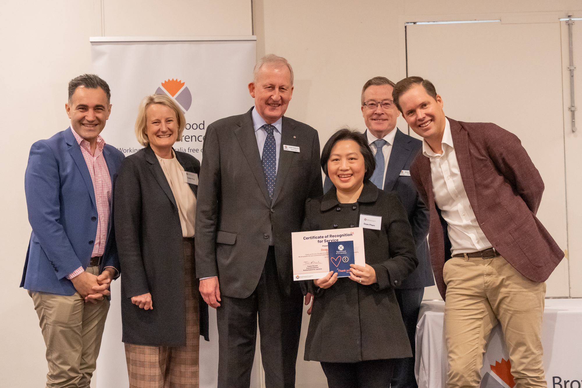 BSL staff member, Doan receiving her award for 20 years of service