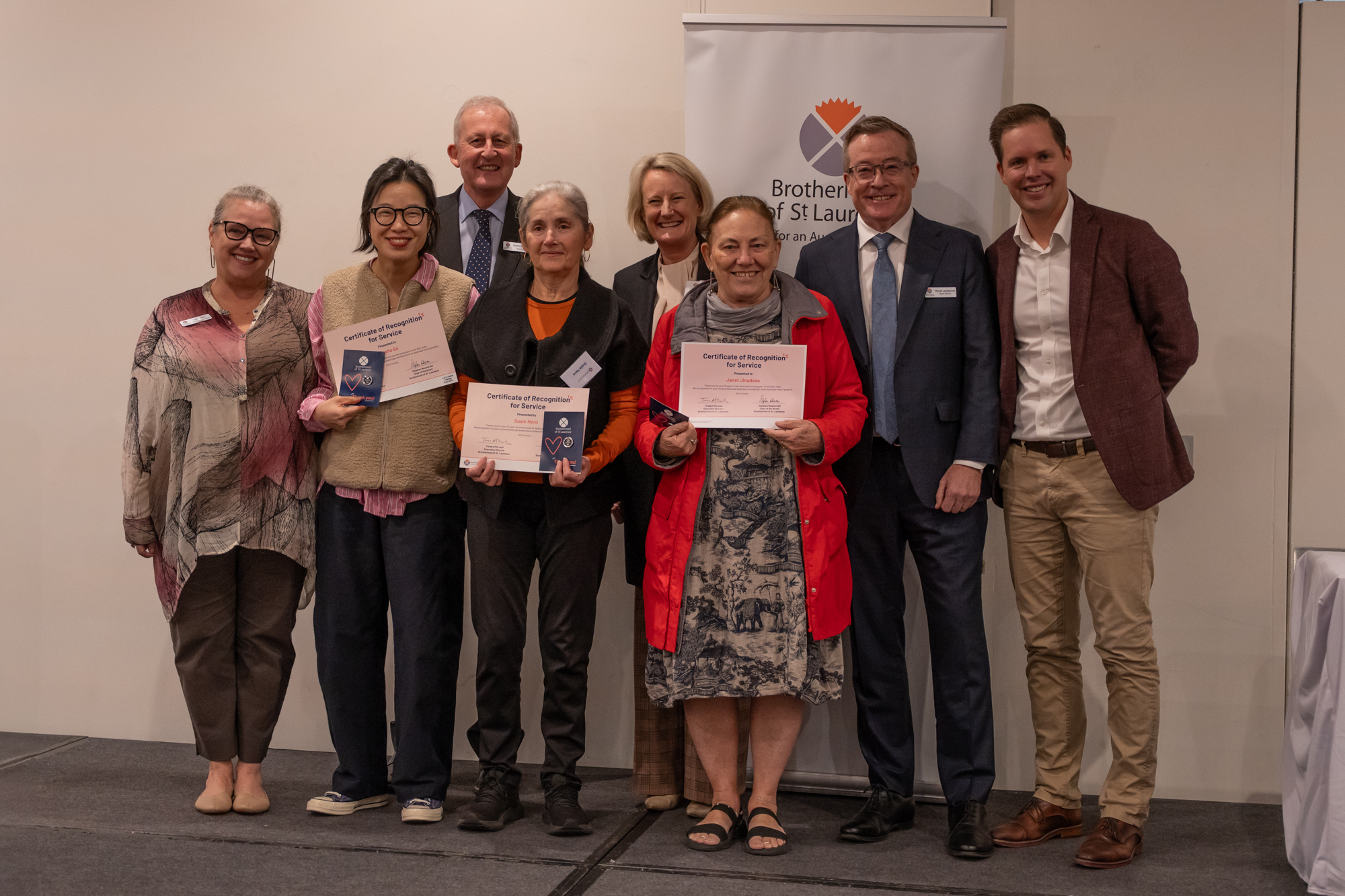 BSL staff member and two volunteers receiving their awards for 15 years of service.