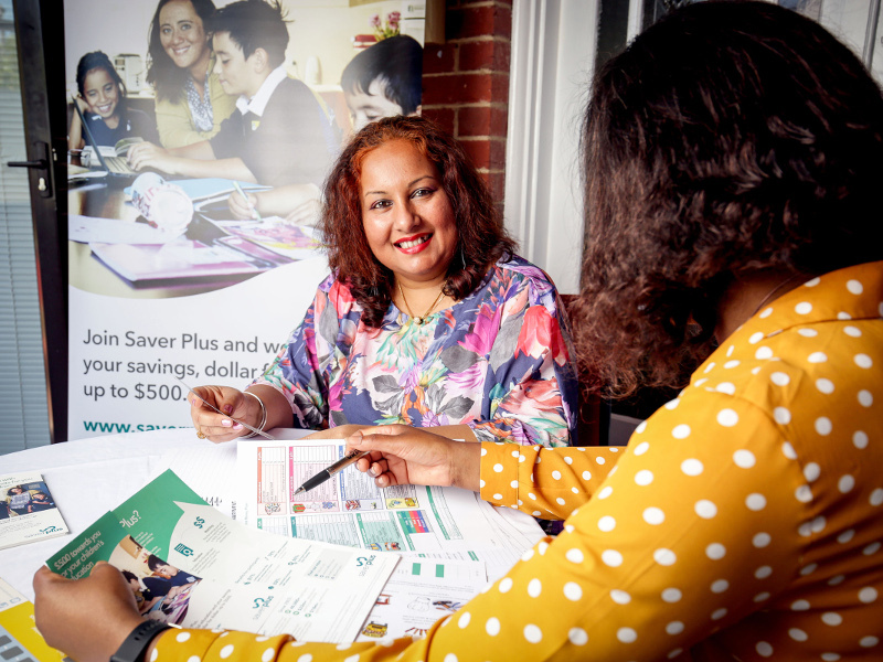 Chithrike going through forms with her Saver Plus tutor