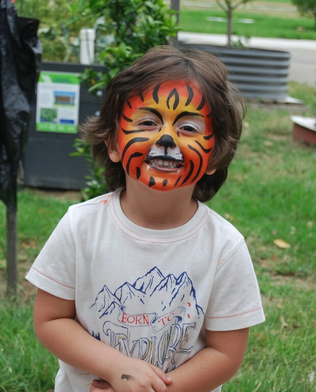 Smiling Jafar wearing tiger face paint