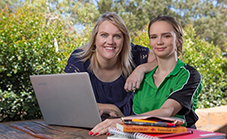 Sharon and ner daughter with the laptop bought through Saver Plus