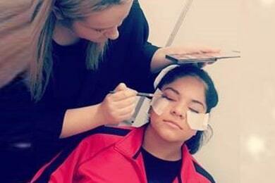 Students practising makeup application on one another