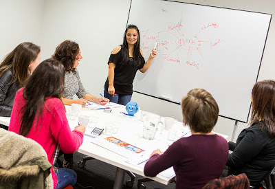 Teacher at whiteboard in Saver Plus classroom