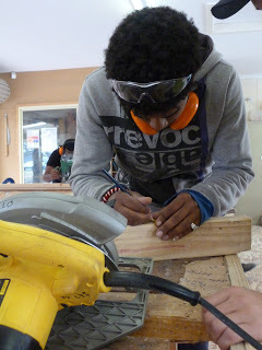 Person at work cutting wood