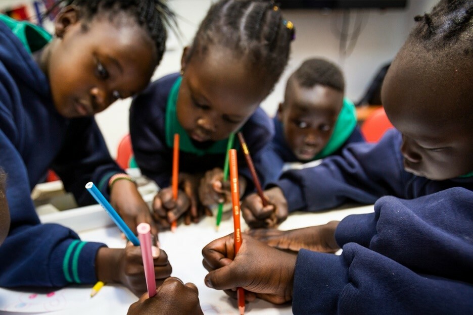 Above: Children from Sacred Heart Primary School completing a colouring activity during Breakfast Club.