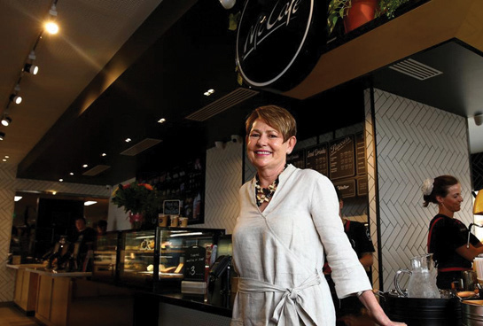 A woman stands in front of a McDonalds store counter