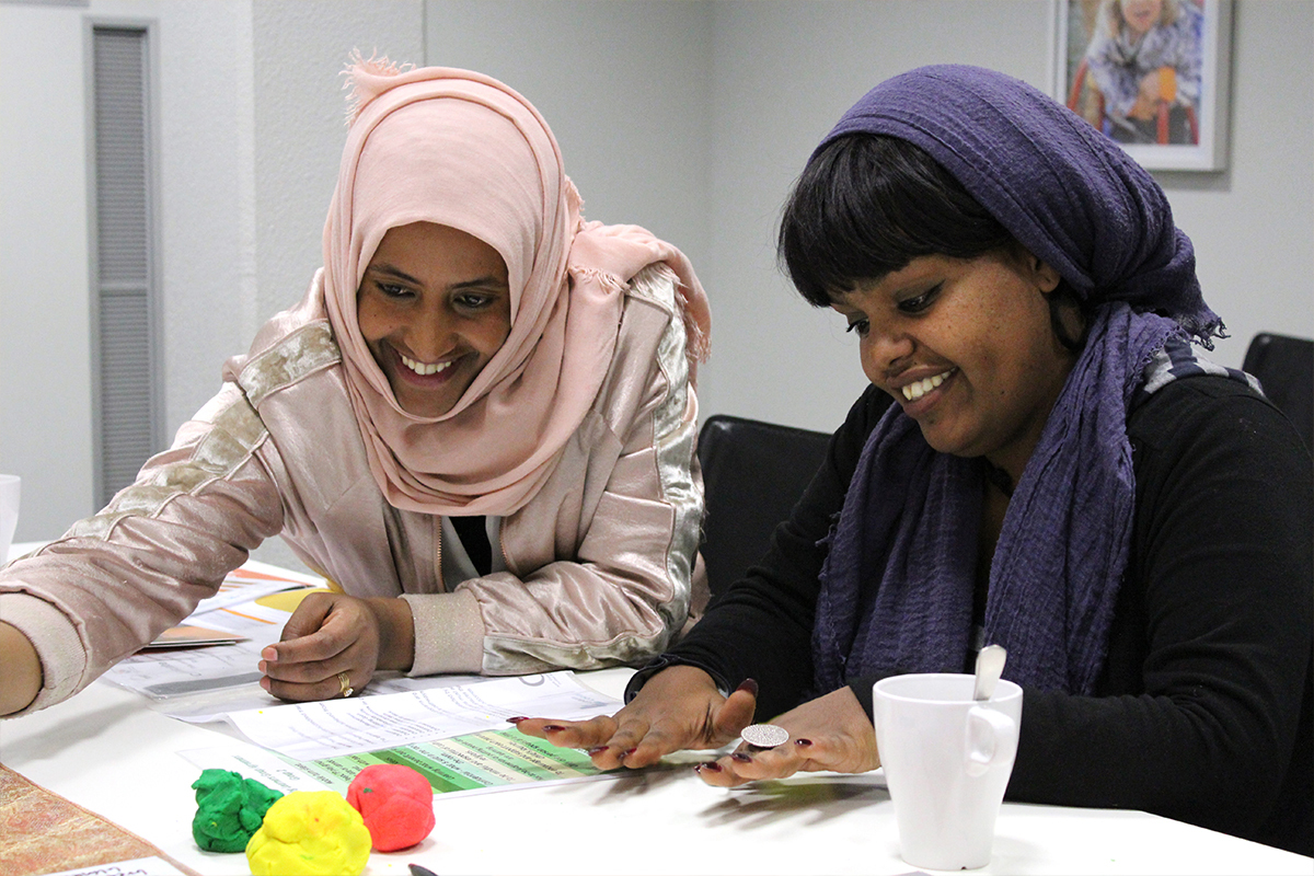 Local mums participate in training for early childhood education.