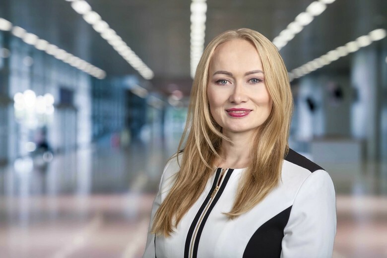 A business woman in an office foyer