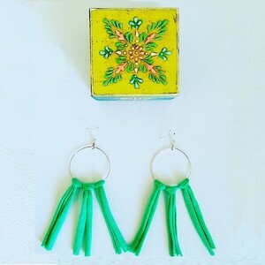 Large earrings with hoop and green tassles
