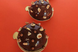 Cakes covered in chocolate and nuts
