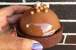 Small cake with chocolate mousse on top
